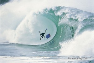 A surfer wiping out in very spectacular fashion at Waimea Bay, on the north shore of Oahu, Hawaii. Surfer Wiping out